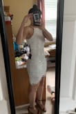 I bought two of these dresses (a small & extra small) for my graduation in June. I tried on the small first, and it was a little baggy. I tried on the extra small, and it fit like a glove. I fell in love with it! It is super hard to zipper on your own. Be careful zipping it because the zipper does get stuck a little along the way because of the embroidery. I am a sucker for the high neck look! The dress is great quality! I would just be careful choosing your undergarments because it is a little see-through even through it is a great thick material. I also put on the cup sticky bra to enhance my boobs so they weren't so pressed! It made it look so much better! - Sierah M.
