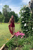 My daughter is a size 0 and we ordered XS. The dress fit perfectly. The sheer outer skirt brings fun into the mix with a peek of the inner skirt. We love it! - Dawn S.