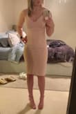 I bought this dress before my breast augmentation and wore it both before and after (photo is after). The small fit before when I was a 32A, but the straps were a little loose and they slipped off a few times. I also had a little bit of room in the cup area. After increasing to a 32DD, the top part fit perfectly. The material feels like it's a good quality and has a nice stretch to it. - Ella K.
