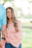 It's got an elastic band around the waist so if you like full coverage on your stomach area then I probably wouldn't get it. I wore this top for my engagement pictures and loved it. It was the perfect color and even with the sleeves it wasn't too hot. - Tiffany B.