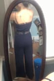 I ordered this for a beach wedding I was in and I love it! The material is good quality and its super cute. I am 5'0 and petite and it fit floor length with a small heal. I think an XS would have fit slightly better but the bigger size was comfortable with the touch of extra room. I love this jumper and will wear it again for sure! The photos are poor quality and don't do the jumpsuit justice. - Molly O.