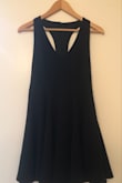I am 15, and my body is still developing. Therefore... it can be hard to find dresses that fit me right. But I love this one! I am 5'8" and this dress is a great length. I love the back because it shows just the right amount of skin, but also covers up enough. The skirt is super adorable, and I love it's shape. The material is super great too because it holds a really nice shape. The ONE thing... is that because it is a low V-neck, it's a little difficult to find a bra that works well with it, considering the back is mostly open as well. If the bust area specifically was just ever so slightly tighter, or if I could find a padded bra that works well with it, then the top may fit slightly better. But even without that fix, it is awesome. I am overall in LOVE with this dress and anticipate wearing it over and over. So to conclude... I am very happy with the purchase that I made, and would highly recommend it to someone else! :))) - Scarlett M.