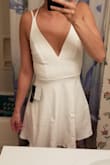I really wanted this to be my graduation dress but it fit me very awkwardly. IDK if ordering a size larger would've helped but it made my torso appear short. Also the strap nearest the arm kept wanting to slide off my shoulders. Maybe it's my body type but it didn't work for me. - Autumn L.