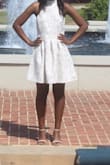 I've never bought a dress from this site and I just knew after scrolling this was THE dress. I usually wear a medium in dresses but after looking at the reviews I sized down to a small. The chest and waist area are a little big and baggy so I probably would've been ok with an extra small but overall its a good dress. It's kinda heavy but feels expensive and looks expensive and that's what I love. - Kiana W.