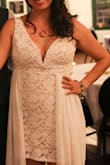 At the time of ordering, only size large was available so I got that and had to have to altered to fit me. Still no regrets because it was exactly what I wanted for a Florida wedding celebration in May. I had it altered tight enough that I didn't have to wear a bra with it (or use tape). I wanted the opening in the front to be bigger so I didn't trip over the length so I had it widened. Came out great in photos esp when there was wind. Very comfortable to wear all night. The bodice piece underneath reads slightly cream colored. - Stephanie B.