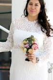 I normally wear a medium but got a size large for this and it fit comfortable. I wore it for my ceremony and then changed into another dress for the party. It covered enough to be modest but also showed enough to be fun. I didn't alter it at all, fit perfectly with a hint of wiggle room. - Stephanie B.