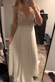This dress is very flattering and looks nice considering the price. It has a light beachy feel which I was going for. Not "perfect", but definitely better than other dresses that I have tried on. Will wear this as a second dress or for other wedding events. - Kristin C.