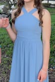 This is a very simple yet elegant dress. The front design really draws attention. 
When it first arrived, I thought it was too plain and the color seemed grey-ish and not very appealing. Then my daughter put it on with her hair and accessories and it was just perfect! The pictures outdoors turned out fabulous - the dress was the same color as the sky.
I ordered an S and an M as she seemed to fall within the M measurements, but from reading reviews I saw that girls with her measurements had fit into S.
The small fit her almost perfectly. I did not even shorten it as we did not have time; however, it would have been better to take in 1 -2 inches.
I would recommend this dress especially for its price! - Teodora H.