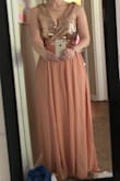 The dress is gorgeous and of great quality. It was so tight around my ribs I could barely breathe. Then to top it off the cut of the dress is totally different than what was pictured. I'm pretty petite and small chested and thought this would be perfect, but when I got it the front of the dress actually crosses over so it was super baggy and droopy unless I shortened the straps. Then when I shorten the straps it was an open V-neck like pictured. There were pleats in the fabric preventing you from being able to wear it the way it's pictured. I was so disappointed. - Madison B.