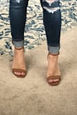 Bought these for a wedding! Haven't worn them yet, but I've been trying to wear them around the house to break them in. The toe part is tight, but I have wide feet. I've been using a shoe stretcher which helps. Wish Lulus would make wide shoes! Love the color of these, and the thick heel make them comfortable. Bought 6.5 (my usual size) and besides the tight toe part, they fit good. - Gabriela S.