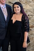 I was really happy with this jumpsuit. The material had some stretch, which was great, and I felt very comfortable in it. I did however have to have about 4 inches hemmed off the bottom because it was so long and I'm not very tall. Luckily my grandmother was able to do it for me in time for a wedding we attended. Overall, pleased with this item! May get more in other colors. A little form fitting and I'm always self conscious about my stomach, but the ruffled part helped with that. Paired with a lace sweater and overall really liked the look! Got a lot of compliments. - Sam L.