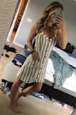 I'm obsessed with this dress! It is a linen-like material and so easy for summer. It's a great length and a bit longer than most Lulus dresses I've tried on. The buttons are functional. Fits true to size and fit my chest great (32DD). I'm SO excited to wear this on a beach vacation to Jamaica this summer! - Ashley W.