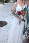I was pleasantly surprised by the quality of this dress. The bodice and bust was far too big, though! I am an A cup and was frantically looking for silicone cups to fill out the top. The waist line is also a little baggy. I used a white sash from another Lulus dress to cinch the waist, which worked decently well. If you are narrow waisted and have a small bust, I recommend sizing down as the hips are generously cut. The dress was also quite long. I am over 5'8" and the small was past my feet, but worked well with heels. - Katharine M.