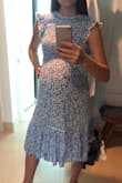 I bought this dress to wear post pregnancy, but since it's stretchy it fits now. I am about 37 weeks along. I can tell this will work perfect after pregnancy too because it is fitted at the top but forgiving in the midsection. Looks more expensive than it is. - Brittany K.