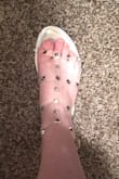 Plastic is practically invisible and very comfy. They are wonderful silver sandals - wear them to work all the time! They have LOTS of holes for any leg thickness (on the buckles). 10/10. Super adorable. - Haley M.