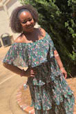 I wasn't sure how I felt about this dress when I initially received it, but it ended up being one of my favorites! The layers are so feminine and they catch the wind perfectly. I felt beautiful in this dress and received lots of compliments. The green pattern is lovely as well. I absolutely love it! - Emosha W.