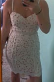 This dress is super pretty but awkwardly tight in weird places. The waist was really tight and uncomfortable making the dress bulge at your stomach. - Kylee P.
