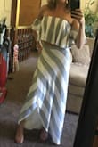 I bought this shirt and the matching skirt. Love them together! I don't know that I would wear the shirt alone as it's kind of short, but it's perfect with the skirt. The top also has a slip layer, so that it's not see through. I can tell that it allows a lot of extra room so someone who may be bustier would also fit into this size. That said, I appreciate that it doesn't look baggy on me either. The ruffles provide a lot of forgiveness and anyone could look good in this! Highly recommend you buy both pieces! - Lauren C.