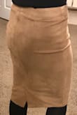 I've been looking for a tan color that will go with everything and this is it! True to its color and size. The waist is forgiving. The material is super soft, very stretchy and durable yet still lightweight. I also love the cut on the back of the skirt that opens so that it's not revealing my whole back legs with or without stockings. I feel confident in this skirt. - Amanda M.