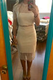 The dress is absolutely beautiful! I normally wear a medium, but after reading the reviews I sized down to a small and it fits great! It's not super tight (which I prefer) so if you want it tight, you could probably size down to an XS. I'm wearing it for my bridal shower and I'm sure it'll be a huge hit! - Jillian D.