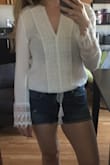 I love the elastic band around the bottom of the shirt. It's comfortable and will be my go-to summer top this year. - Andrea W.