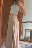 Had my eye on this for a while... finally took the plunge and so glad I did! This is a high waisted skirt. The material is light, soft and flowy- fits as described. Paired with the white cropped tank and leaves just enough skin to add flair! Lulus dresses usually have a too-high slit for me to feel comfortable wearing, but this one is low enough to be classy to wear around Grandma, I swear. (Lulus is forcing me to crop my photos. Argh!) - Jennifer L.
