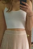 Fit is tight and good quality, but you can not squeeze a bra under this top, you will need bust petals 100% due to the material. The straps make me worried that they are so fragile and will rip off or tear when out and about wearing it. I paired this with a high waisted skirt from Lulus. Looks super cute! Hoping this holds up. - Jennifer L.