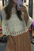 This shirt is cute but was too long of a crop top to wear with a skirt. Ran a little large overall! - Cassidy B.