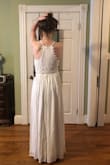 This dress is incredible - especially given the price! It's a great weight, texture and creamy color - candlelight, not harsh white. The detail around the neck and waist add interest. I couldn't decide between the black or white, so I'm keeping black & cutting it short for a cocktail dress. Fabulous Find! I do need to have cups sewn in white version . - Lisa M.