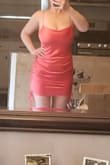This dress is super sexy! It is great for us big chested curvy girls. I don't even need to wear a bra. It provides great support. I love how you can adjust the length. The way the waist lays hides a little belly if you have one. I was worried it'd look like lingerie, but nope. It looked like one heck of a sexy dress. The color is like a darker coral. Very pretty color. Sure to stand out in the crowd. - JILLIAN W.