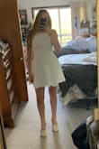 I love this dress!! I was scared it was going to be too short, but it is a perfect length. You can't wear this with a normal or strapless bra but a sticky bra works just fine. I am so happy with this dress! - Erin D.