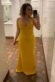 I had been searching for the perfect dress for weddings this year, and I finally decided on this yellow one after seeing great reviews. Much to my DISMAY, they only had XLs left. I measured out to be a medium. I bought it anyway and got it altered. However, I also ordered the forest green in medium and it fit like a glove. It's just a bit long for me at 5'4. Expect to hem if you are under 5'8. Thick material and I did not need a bra! I had to me shorten the straps quite a bit to keep those babies in though. Overall amazing dress for the price. - Ilissa S.