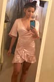 My try on pictures I took aren't the best, but I hope this helps a little. I absolutely love this dress. I love it so much that I went back online when I received the soft pink to grab the magenta. I missed out on the green in my size. :( Anyway, it fits great. The chest part is pretty opened if you're feeling sexy. I'm definitely going to purchase the fabric tape though for the chest area so it can be secured and less cleavage. - Tana G.