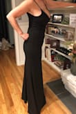 Very flattering! I ordered the white in a medium and the black in the large. The large and black were much more flattering while the white showed my flaws. - Cheryl B.