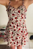 Super cute dress! It looks exactly like the photo, and the print is very vivid. It does run large though, and I would return my small for an extra small if it was in stock, but I need it for my graduation. My chest is also pretty small, and it is quite loose in that area. Nothing a strapless bra wont fix though. I'm excited to wear it! - Sarah Y.