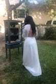 I originally bought a medium but I had to return it because it fit too small. I had to return it and buy a bigger size and it fit very well. I really wanted to wear this dress for my bridal shower. My family and friends loved it. I really love this dress. - Yenizeth N.