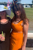 I ordered the white and the orange in a large. Both are cute, but even at a larger size they made my relatively flat stomach appear larger. It did work for my hard to fit 32H bust though. Sent the white back and wore the orange for a derby party. - Cheryl B.