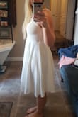 Cute dress but I find it runs large, by measurements I should be a Medium. However, upon receiving it I would fit a small. A lot of material on the lower half and made my short athletic figure and large hips look bigger then they are. Heavy, good quality material though. - Megan F.
