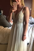 This dress is absolutely stunning! I bought it for my upcoming elopement wedding. :) I cannot wait for him to see me in it. I felt so beautiful!
It is long like I read in most reviews, but I will get it hemmed. - Brittany S.