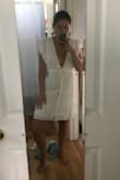 Ok so I love this dress. Buttttt I think the super low cut is a little too glamorous for a gal like me. Sooo I actually had my mom sew two extra buttons with an elastic loop to tighten to top a bit. Then it was perfect! It's a little sheer but not to the point where I would be uncomfortable wearing it... nude undies are totally fine. The waist is preeeettyy tight so buttoning it up is a challenge. I anticipate me shedding a couple lbs so it's a little more comfy. Other than that it's perfect! Length is good! Not mini but also not long! I have before button try on photos. I'll show the buttons my mom added. This dress is defff for ladies with small chichis. Not large chested for sure. - Mimi H.
