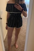 I am always self conscious when it comes to rompers, but this one is just too cute to pass up! I have a long torso, so it's a little short in the back. Nothing hangs out unless I bend over a lot though. When you try it on, make sure you wiggle around so the waistband can settle so you can make sure it's not too short. The off-the-shoulder style is so cute, and I cannot say enough good things about this romper. It's flowy and airy, and it's so great for spring and summer. I'm tempted to buy the white one too! - Caitlin B.