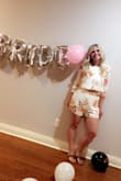 Looks exactly like the picture. Love the color and the floral print. The arms were long but I just pulled the sleeves up and made it a 3/4 length. Got tons of compliments and wore it during my bachelorette - Abby B.