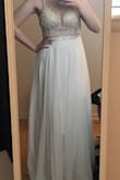 Beautiful dress! I ordered a 6 being afraid it would be too small (I'm normally an 8 but they were sold out) but a 4 probably would've been better. It was a little loose in the back so it didn't sit right and the straps were too big. This was a contender for my wedding dress but decided to go with a different Lulus dress (see : Ocean of Elegance dress). Overall, it was absolutely beautiful and such a great dress for the price, just not exactly what I was looking for! If you're hesitant, buy it - returns/exchanges are soooo easy!!! ;) - Ashley A.