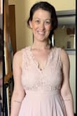 I tried it on and the dress is beautiful. The back is lovely and it's nice and light. The dress just wasn't flattering on my chest, and the colour just didn't work on my skin tone! - Sarah K.