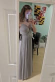 This dress is very beautiful. The color has a slight bit of lavender tint in the light grey, but still overall is light grey. The only thing is the dress is veryyy heavy. In the case in which I am using it, as a bridesmaids dress, the heavy feature should be nice for an outdoor wedding though, so hopefully if it is windy then the dress won't fly up. For storage, I could not hang the dress by it's straps since they are so thin and would be potentially damaged from the weight they're holding. The fit is spot on and the material is not scratchy. Everyone who has asked to see pictures of the bridesmaids dresses has said they were gorgeous. I can not wait to wear it. - Alyssa S.