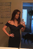 It fits perfectly. The fabric is much nicer than I expected, and can be pulled off without wearing a bra since it holds itself up. 
It feels incredibly glamorous the moment you put it on. Definitely plan to get it hemmed though. The material has a bit of a stretch to it, so it's forgiving if you're in between sizes.
I'll be leaving my hair down and throwing on a red lip. - Hannah D.