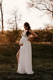 This dress meant so much to me and worked perfectly for our maternity photos. I couldn't have asked for a more perfect dress. - Cara G.