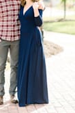 I got this for my engagement photos, and it was amazing. Since it's a wrap dress, it's easy to make it fit your body. The material is kind of that thin, stretchy type, so you definitely want seamless underwear! - Haley H.