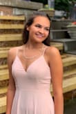 I wore this dress for my prom and I loved it so much!  It's very elegant and I got so many compliments on this dress. My only issue with it was that since I'm only 5'2 it was very long even with heels. I ended up having to get it tailored ($64 at Nordstroms which took about 4 days), so if you're short like me you'll likely have the same problem. With that said, I would 100% buy this dress again. The quality was amazing and I was really happy with how I looked. If you're shopping for a special event, I highly recommend! - Cassidy C.