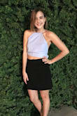 Would have given it five stars if not for the fit. I ordered it for a wedding shower and didn't have time to return it and wait for the new size before the event, so that's on me. I wore it out one night and found that tying the bow in the back tighter helps the top fit and it looked fabulous! This shirt is gorgeous and classy! - Clare G.